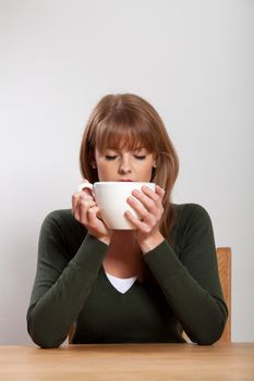 young woman with a cup of coffee