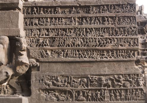 Hindu religious story carved into the rock face at the ancient Hindu Temple (Kailas Temple). Cave number 16, Ellora Caves site, India. 8th Century AD