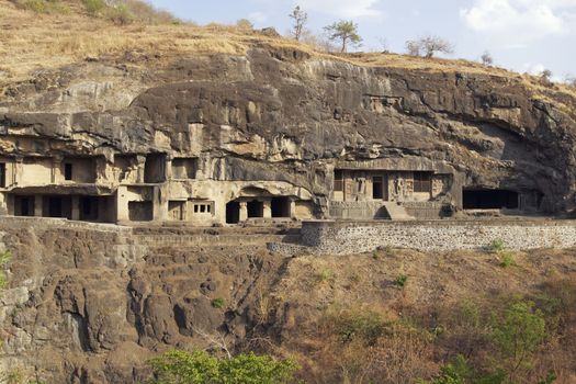 Buddhist cave temples carved out of the solid rock of the hillside at Ellora Caves in India. 7th-8th Century AD