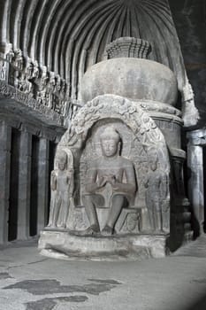 Stone statue inside rock carved Buddhist temple (Vishwakarma Cave Temple), Ellora Caves near Aurangabad, India. 7th-8th Century AD.