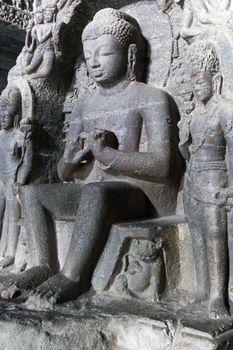 Stone statue inside rock carved Buddhist temple (Vishwakarma Cave Temple), Ellora Caves near Aurangabad, India. 7th-8th Century AD.