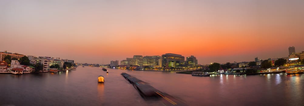 Panorama Chao Phraya River in the evening.traffic boat in river and sky cloud at evening.