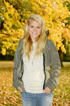 young blond woman  in autumn park