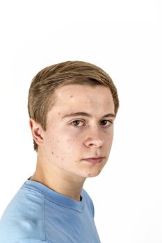 portrait of cool boy with blue shirt posing in studio