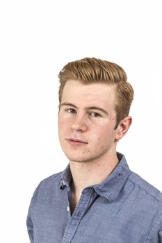 portrait of cool boy with red hair posing in studio