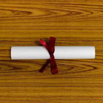diploma on wood background