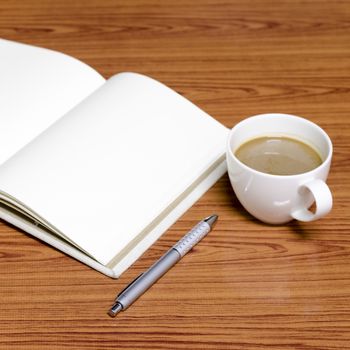 coffee and notebook on wood background concept coffee time
