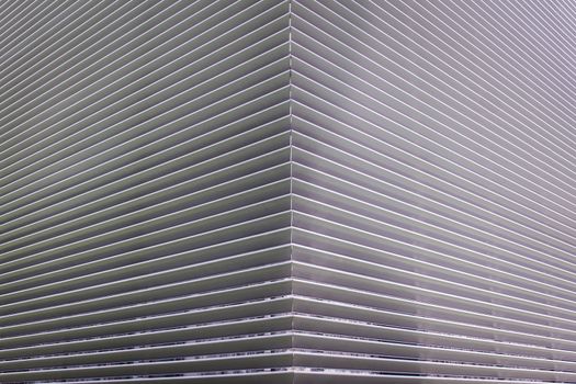 texture of steel ventilation grille on the wall of a building