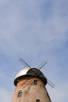 old windmill roof on blue sky background