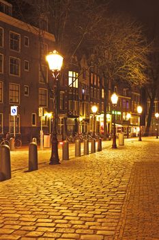 Medieval street in Amsterdam the Netherlands by night