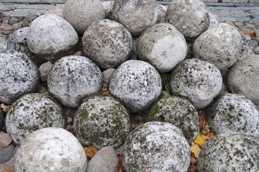 Stone cannonballs in Kremlin of ancient russian city Veliky Novgorod