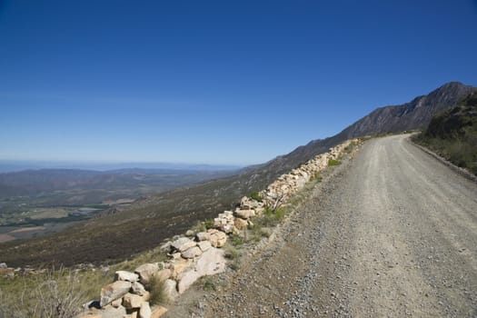 Gravel road heading up to the Swartberg Pass in the Oudtshoorn region of the Western Cape in South Africa