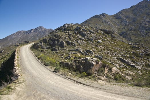Gravel road heading up to the Swartberg Pass in the Oudtshoorn region of the Western Cape in South Africa