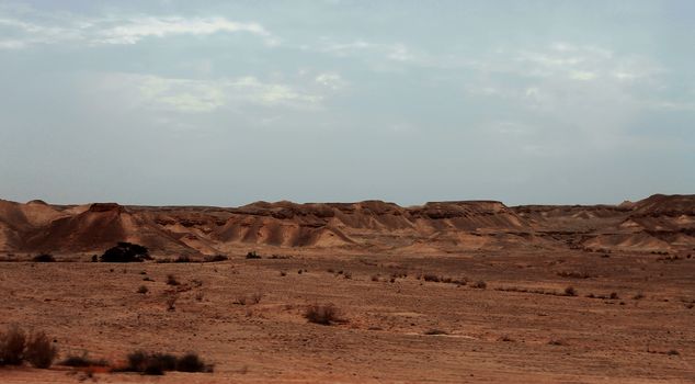 An Egyptian Desert And Mysty Sky in the daylight