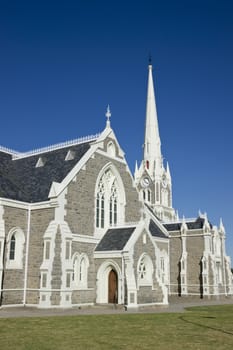 Dutch Reformed Church in Graaff-Reinet, Eastern Cape, South Africa. Imposing building in Cape Dutch style with tall steeple.