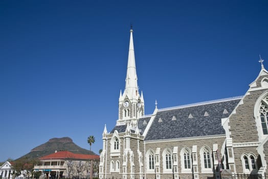 Dutch Reformed Church in Graaff-Reinet, Eastern Cape, South Africa. Imposing building in Cape Dutch style with tall steeple.
