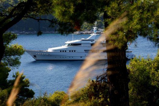 Luxury yacht entering small port,Greece