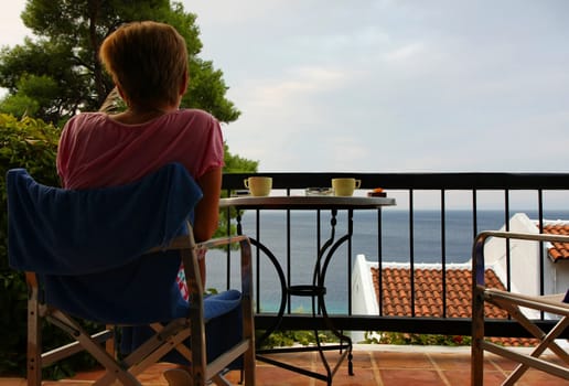 Drinking coffee on the hotel terrace with beautiful seaview