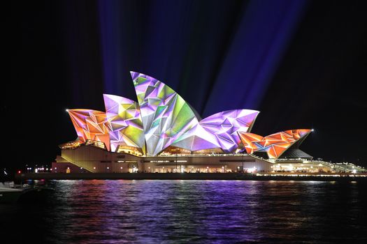 SYDNEY, AUSTRALIA - JUNE 2, 2014; Sydney Opera House illuminated in geometric vibrant colour during Vivid Sydney annual festival of light, music and ideas