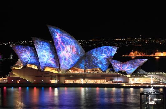 SYDNEY, NSW, AUSTRALIA - JUNE 3, 2014;  Sydney Opera House lit with vibrant colours patterns and moving imagery during the annual Vivid Sydney festival.
