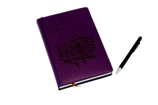 On a white background purple diary, on which lies a red pen to write it