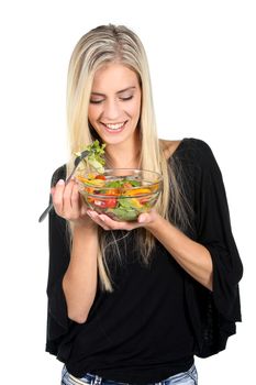 Beautiful slim girl eating fresh salad - isolated on white