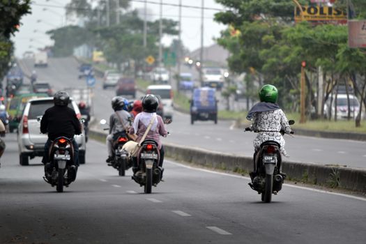 bandung, indonesia-june 5, 2014-scenery of busy traffic in bandung city, west java-indonesia