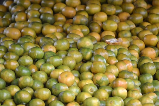 bunch of orange fruit that sold in traditional market