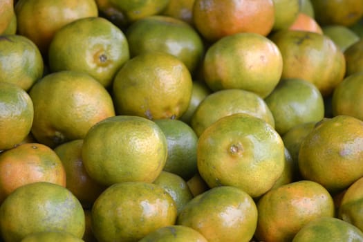 bunch of orange fruit that sold in traditional market