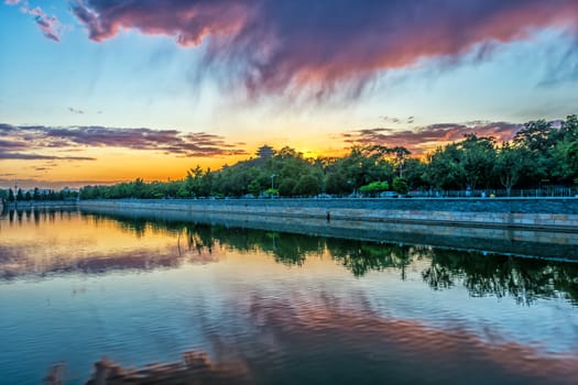 The moat of forbidden city (Tongzihe river) under the sunset light in Beijing, China.