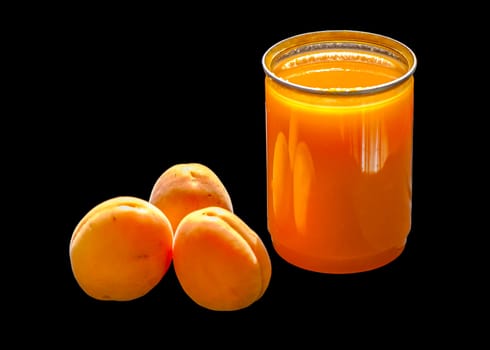 The apricots and apricot sauce with black background.