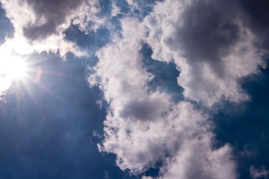 Tropical blue sky with sun and clouds in the afternoon