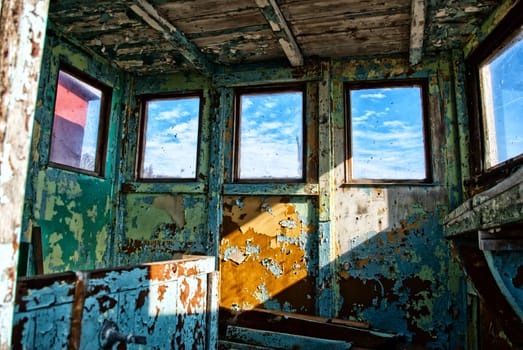 Inside an old weathered colorful wooden shed
