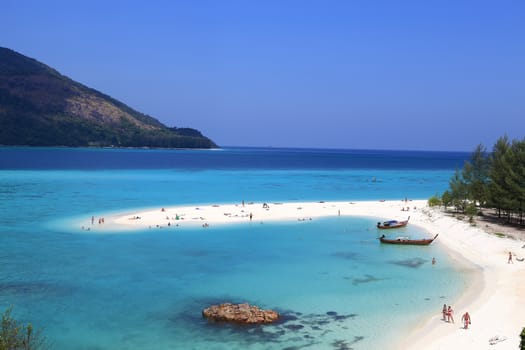 SATUN, THAILAND-February 4: Unidentified people visit  Mountain beach in Lipe island on February 4, 2014 in Satun province, Thailand. There are 3 beaches named Pattaya, Sunrise, and Sunset in Lipe island.