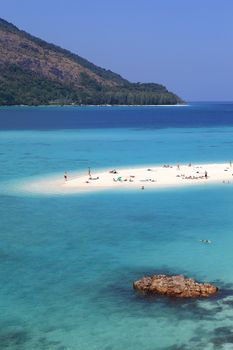 SATUN, THAILAND-February 4: Unidentified people visit  Mountain beach in Lipe island on February 4, 2014 in Satun province, Thailand. There are 3 beaches named Pattaya, Sunrise, and Sunset in Lipe island.