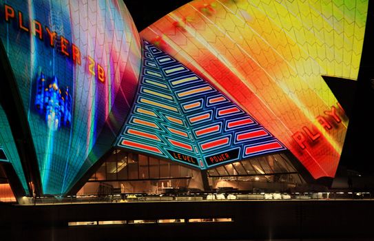 SYDNEY NSW, AUSTRALIA - JUNE 6, 2014; Sydney Opera House roof lit up in bright colorus and imagery during the Vivid Sydney annual festival celebrations.