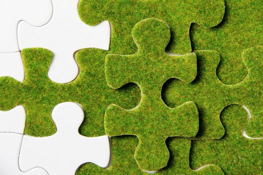 green puzzle piece, green concept