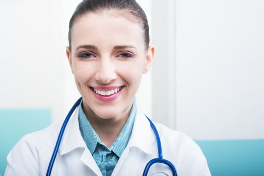 Close up portrait of a young female doctor smiling