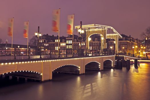 Thiny bridge in Amsterdam the Netherlands by night