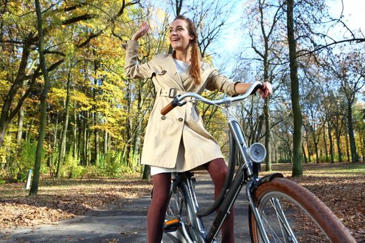 happy woman in autumn bike tour