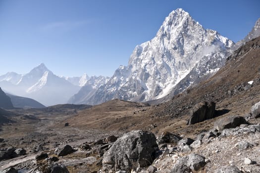 Wide valley surrounded by high mountain peaks in the Himalaya Mountains of Nepal. Most prominent mountain Arakam Tse - 6423m.