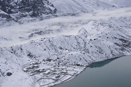 Snow covered village of Gokyo on the shore of Gokyo lake 4800 meters up in the Himalaya Mountains of Nepal.
