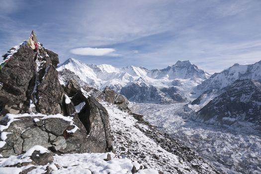 Ngozumpa Glacier flowing down from the high snow capped mountains of the Himalayas. View from Gokyo Ri, 5360 meters up in the Himalaya Mountains of Nepal