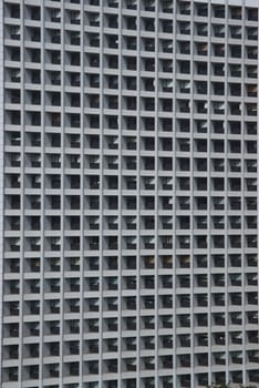 Lattice shaped windows of a modern office block in Hong Kong, China