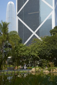 Modern architecture of the financial district towers above a city park in Hong Kong, China