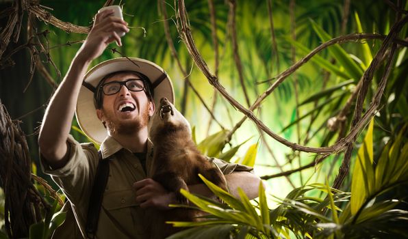 Explorer taking a self portrait with a ferocious animal in the jungle.