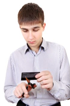 Teenager cutting a Credit Card Isolated on the White Background