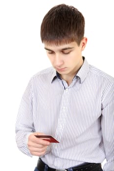 Doubtful Teenager looking on Credit Card Isolated on the White Background