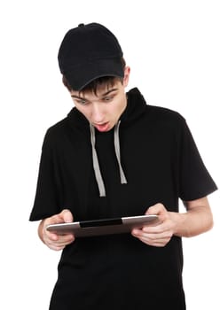 Surprised Teenager with Tablet Computer Isolated on the White Background