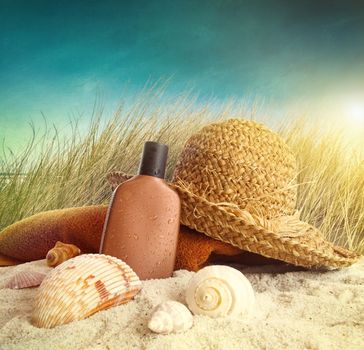 Straw hat with towel at the beach